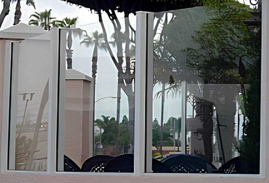 White aluminum finish on glass fencing
